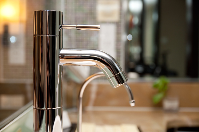 Leaking tap being repaired in Fulham